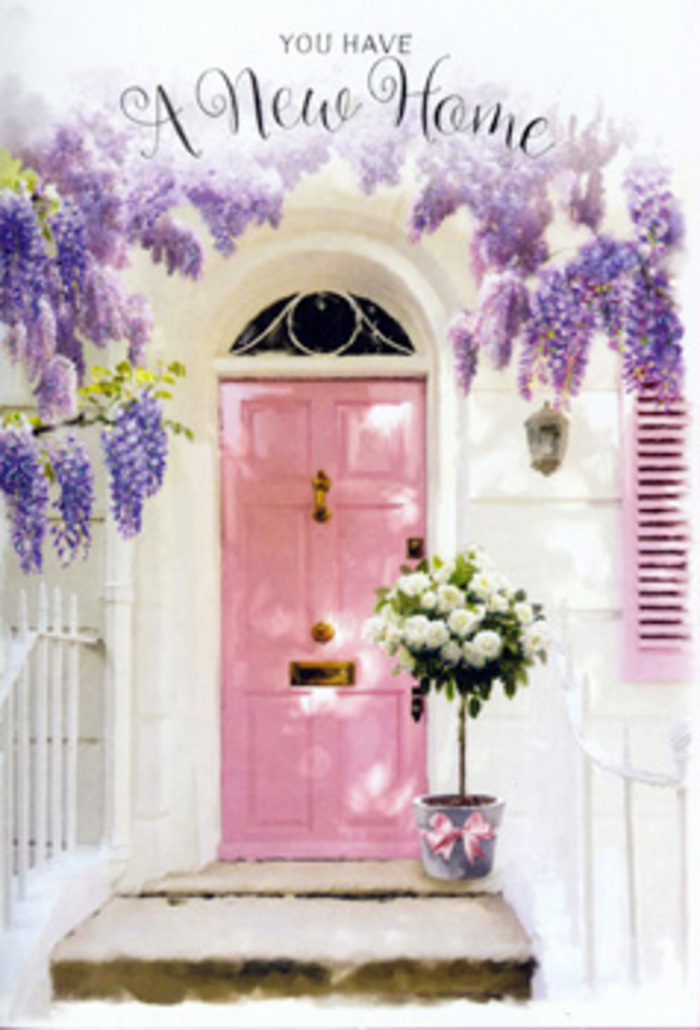 This image captures the tender excitement of arriving at a new home in Barking, expressed entirely through flowers, colour, and light. A pastel pink door, perfectly smooth and freshly painted, stands as the focal point, its gentle hue echoing the softest tones of a spring sunset over Mayesbrook Park. Surrounding it, draping vines of wisteria spill down from above, their delicate clusters of lavender and lilac blossoms creating an archway of natural lace. The wisteria's tendrils twist and trail along the whitewashed wall, adding a sense of age and character while still feeling utterly romantic. Sunlight filters through the blooms, leaving dappled shadows that dance across the step and the base of the door. At the threshold, a florist's grey tin bucket is filled to overflowing with creamy white roses, so full and velvety that they appear almost cloud-like. The blooms are interwoven with fresh yet understated greenery-soft, muted leaves that cradle each rose and give depth to the design. A satin pink ribbon, tied carefully around the bucket, introduces a note of ceremony, as if this arrangement has been placed here to mark an important moment. You can almost imagine a couple unlocking this door for the first time after picking up their keys near Barking station, pausing to breathe in the gentle rose scent before stepping across the threshold. The overall mood is calm, hopeful, and intimate: a visual promise of warm evenings, friendly neighbours, and a home filled with fresh flowers delivered from a trusted local Barking florist whenever new memories are made.